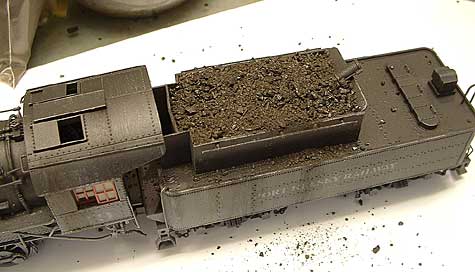 Adding coal.